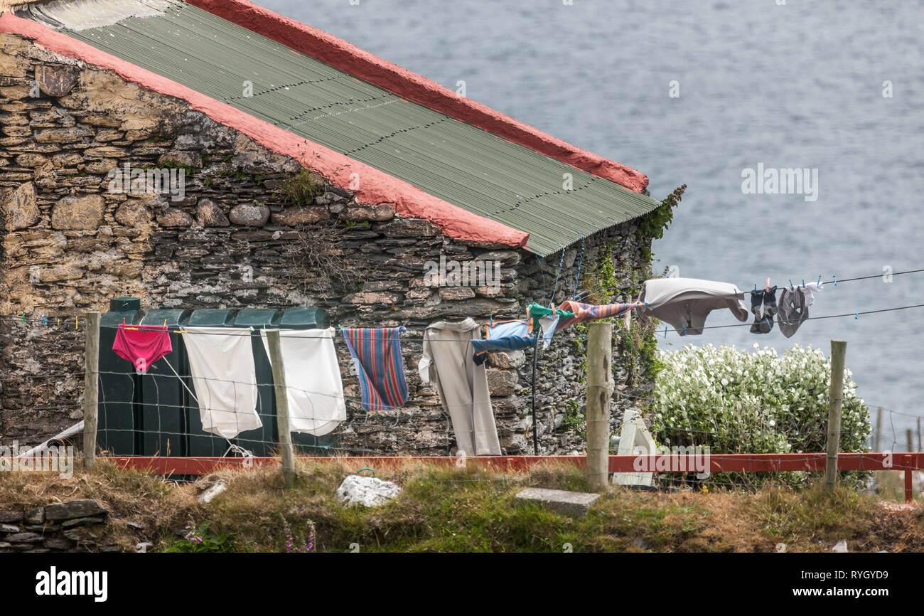 Dursey Island, Cork, Ireland. 12th June, 2016. Washing hanging out to dry on a windy day on Dursey Island, Co. Cork, Ireland. Stock Photo