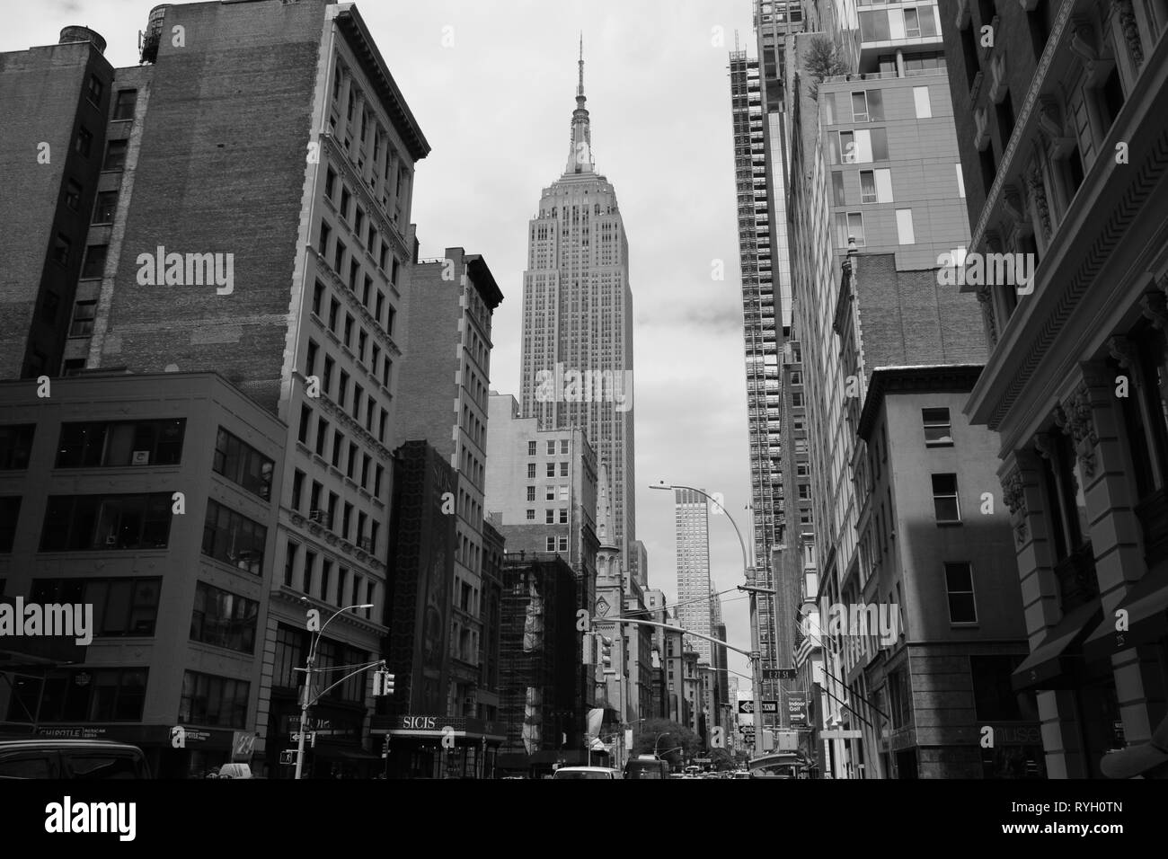 new york city street and buildings with empire state building in the center.black and white shot from 2018 Stock Photo
