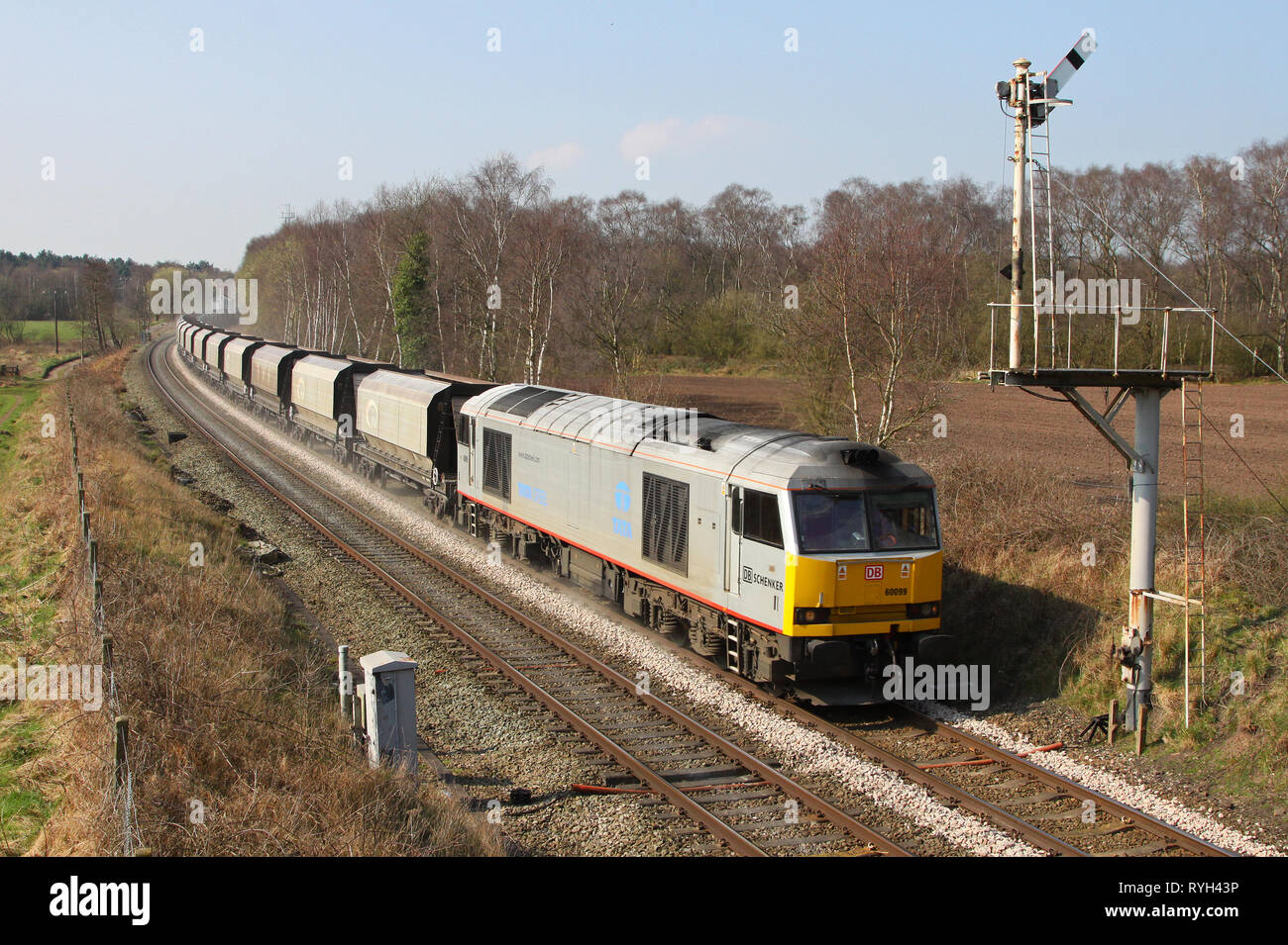Silver 60099 passes Plumley with a Northwich to Peak forest stone empties. Stock Photo