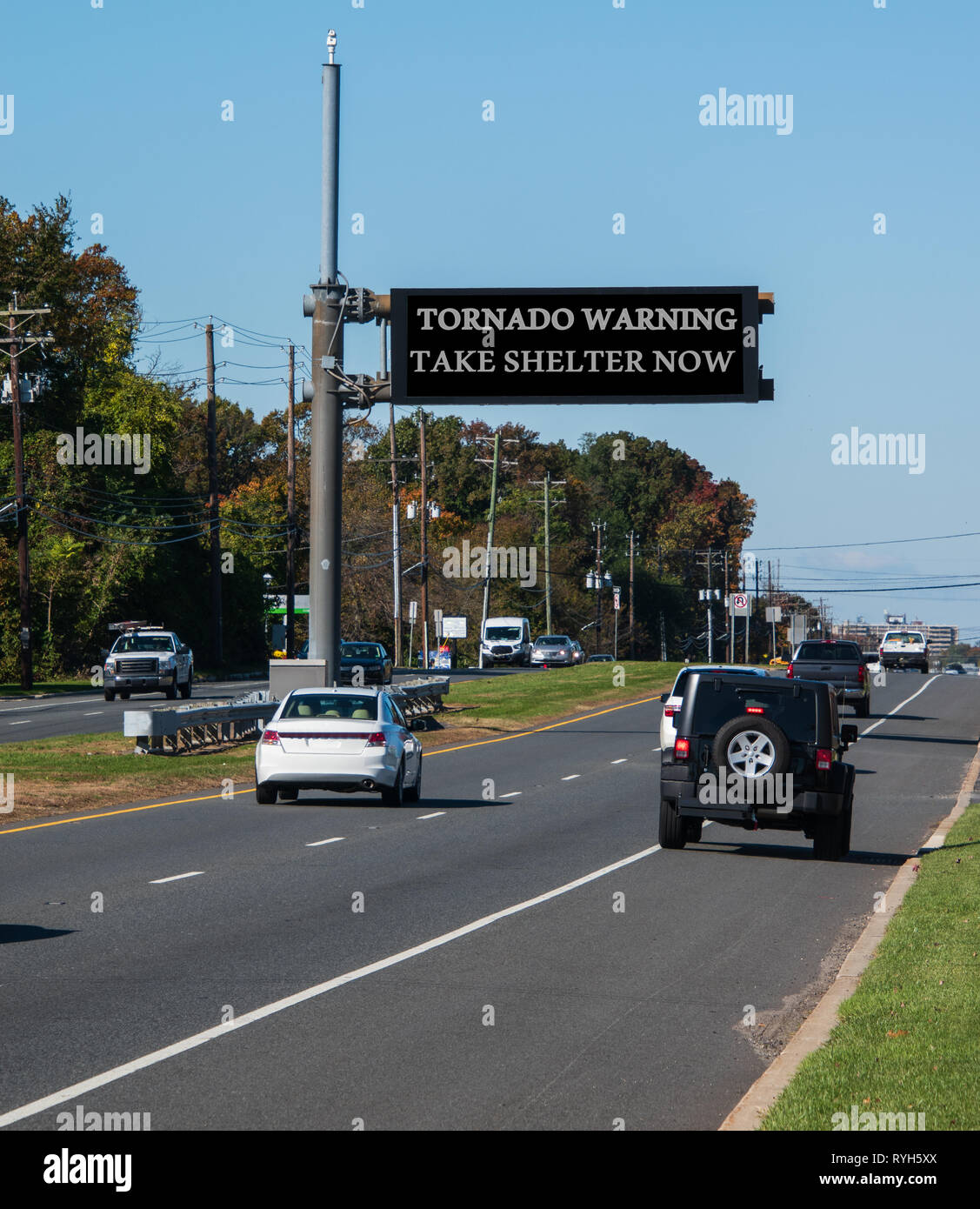 Tornado Warning Take Shelter Now Electronic Warning Sign Over Highway With Cars Traveling In Both Directions Stock Photo Alamy