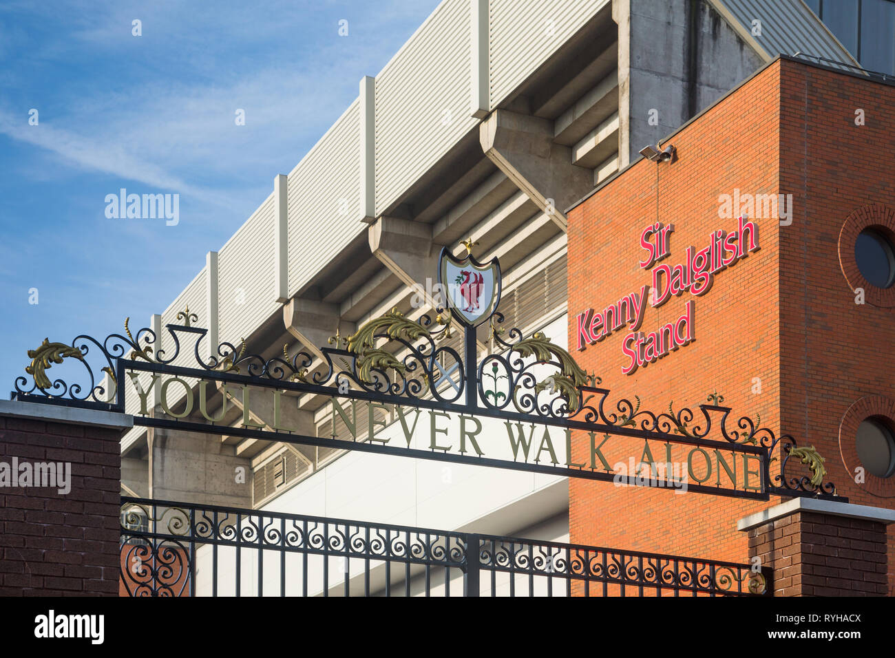 Ornate 'You'll Never Walk Alone' wording above black metal gates near The Kenny Dalglish stand at Liverpool Football Club Anfield Road Stadium, UK. Stock Photo