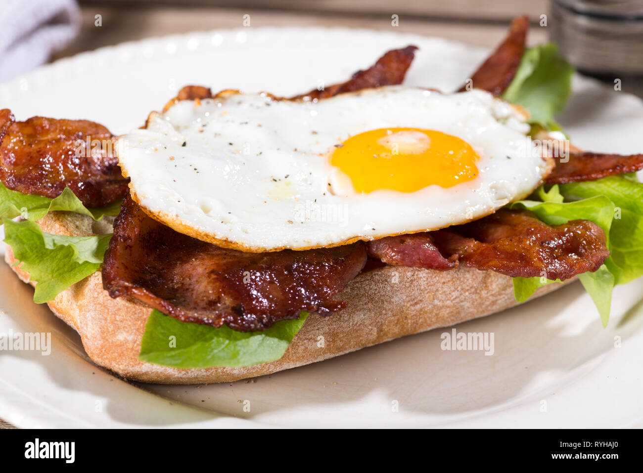 fried egg and bacon sandwich Stock Photo Alamy