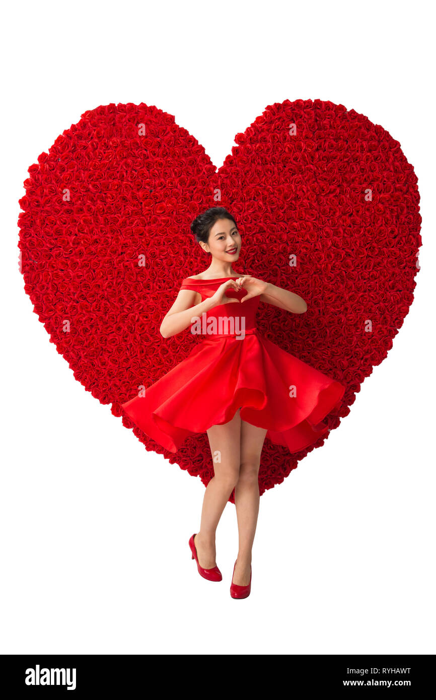 Indian young woman red roses Cut Out Stock Images & Pictures - Alamy
