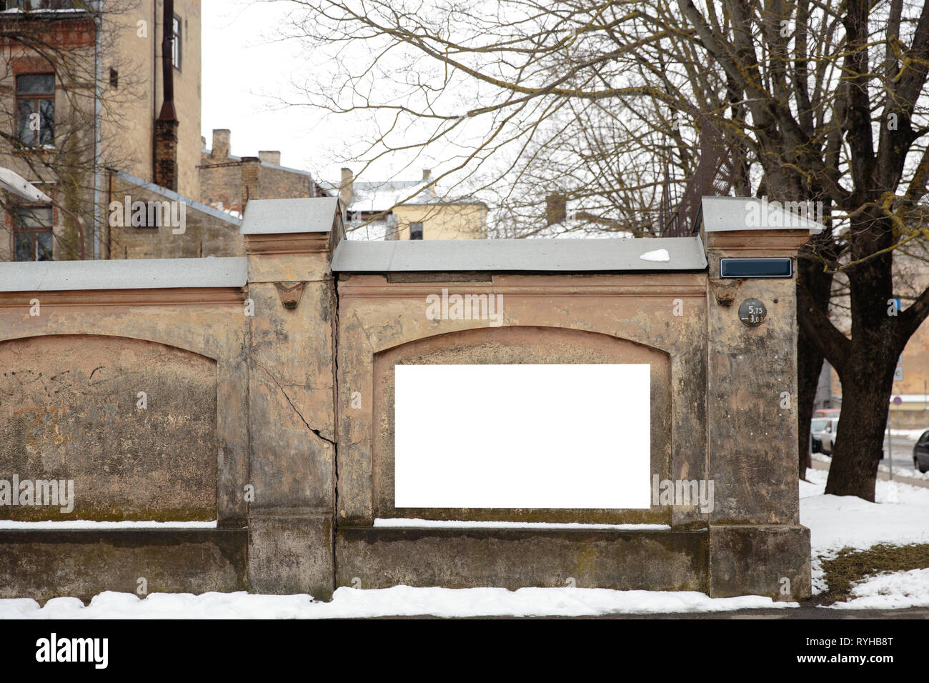 Blank ad space on a concrete wall in the street outside Stock Photo