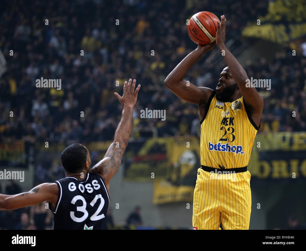 Athens, Greece. 13th Mar, 2019. Malcolm Griffin (R) of AEK Athens shoots  during the 1/8 finals second leg at Basketball Champions League tournament  in Athens, Greece, on March 13, 2019. PAOK Thessaloniki