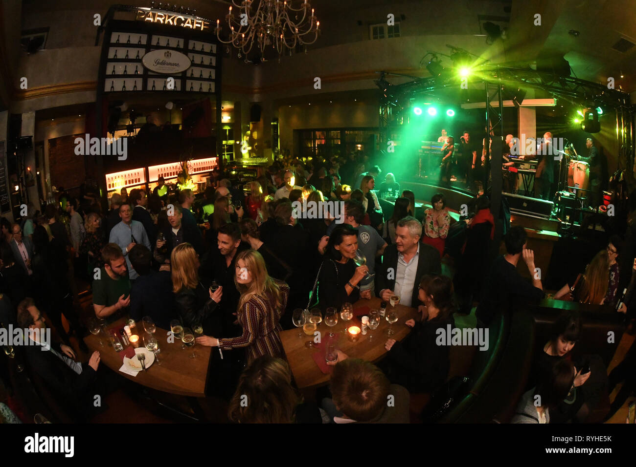 13 March 2019, Bavaria, München: Guests celebrate at the After Work Party of the production company ndf in the Parkcafe. Photo: Felix Hörhager/dpa Stock Photo