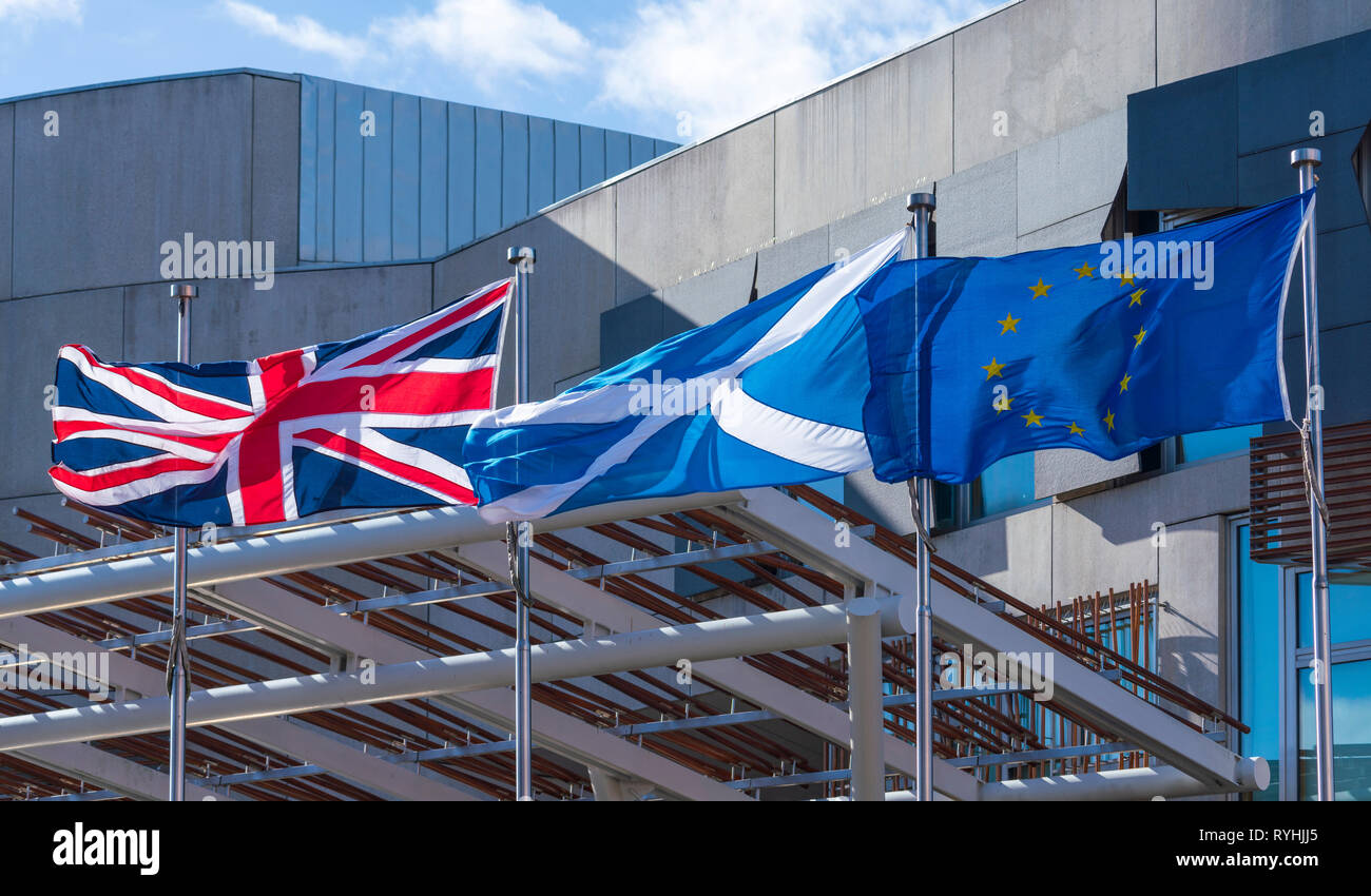 Edinburgh, Scotland, UK. 14 March, 2019. Union Flag, Scottish Saltire and European Union flags flying outside the Scottish Parliament building at Holyrood as Brexit negotiations proceed and the SNP call for another independence referendum in Scotland. Credit: Iain Masterton/Alamy Live News Stock Photo