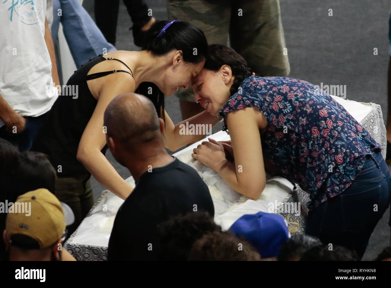Sao Paulo, Brazil. 14th Mar, 2019. SP - Sao Paulo - 03/14/2019 - Attack at Suzano School Velorio das Vitimas - It happens at the Max Feffer Arena in Suzano in Greater Sao Paulo, the wake of the victims of the Raul Brasil State School attack, where 2 shooters ex school opened fire killing 5 students and 2 officials, leaving about 11 injured, then one of the marksmen killed the other and the same committed suicide. The river is expected to continue until 4 pm. Photo: Marcello Zambrana/AGIF Credit: AGIF/Alamy Live News Stock Photo