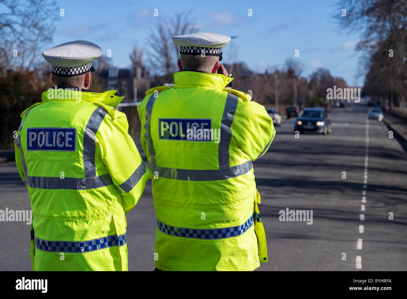 Edinburgh, Scotland, UK. 14 March, 2019. Police checking car speeds in Edinburgh at the first in a series of pilot 20mph ‘Roadside Education’ events, held in partnership with Police Scotland, aiming to raise awareness of the consequences of breaking 20mph speed limits. Speeding drivers will be stopped by Police Officers and offered a short driver education session in a Police Command Unit. Credit: Iain Masterton/Alamy Live News Stock Photo