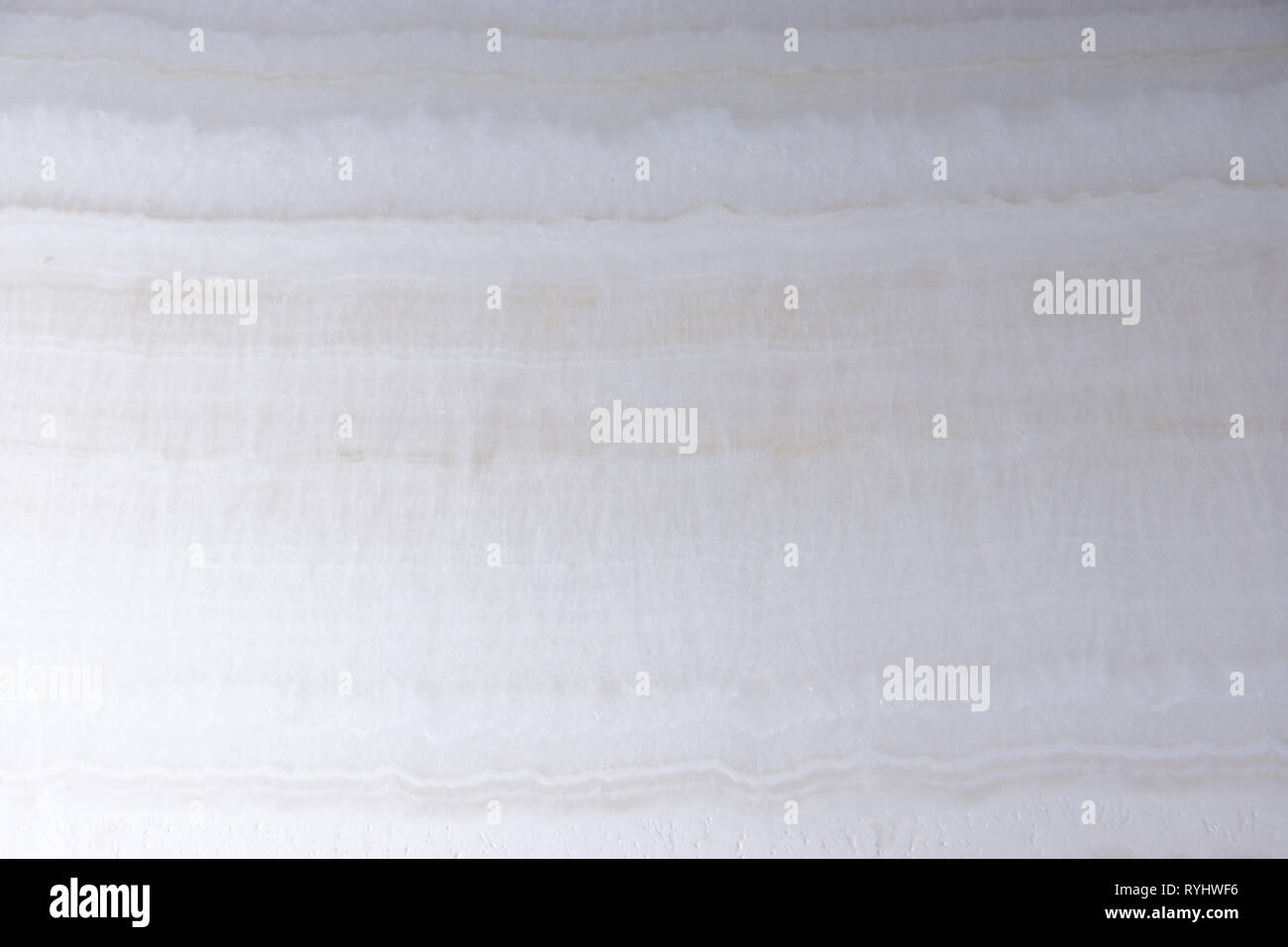 Natural white onyx stone with beautiful waves. Stock Photo