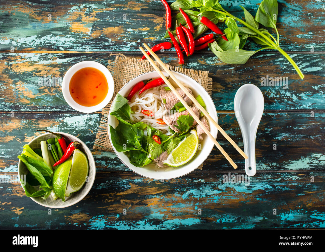 Traditional Vietnamese soup Pho bo with herbs, meat, rice noodles