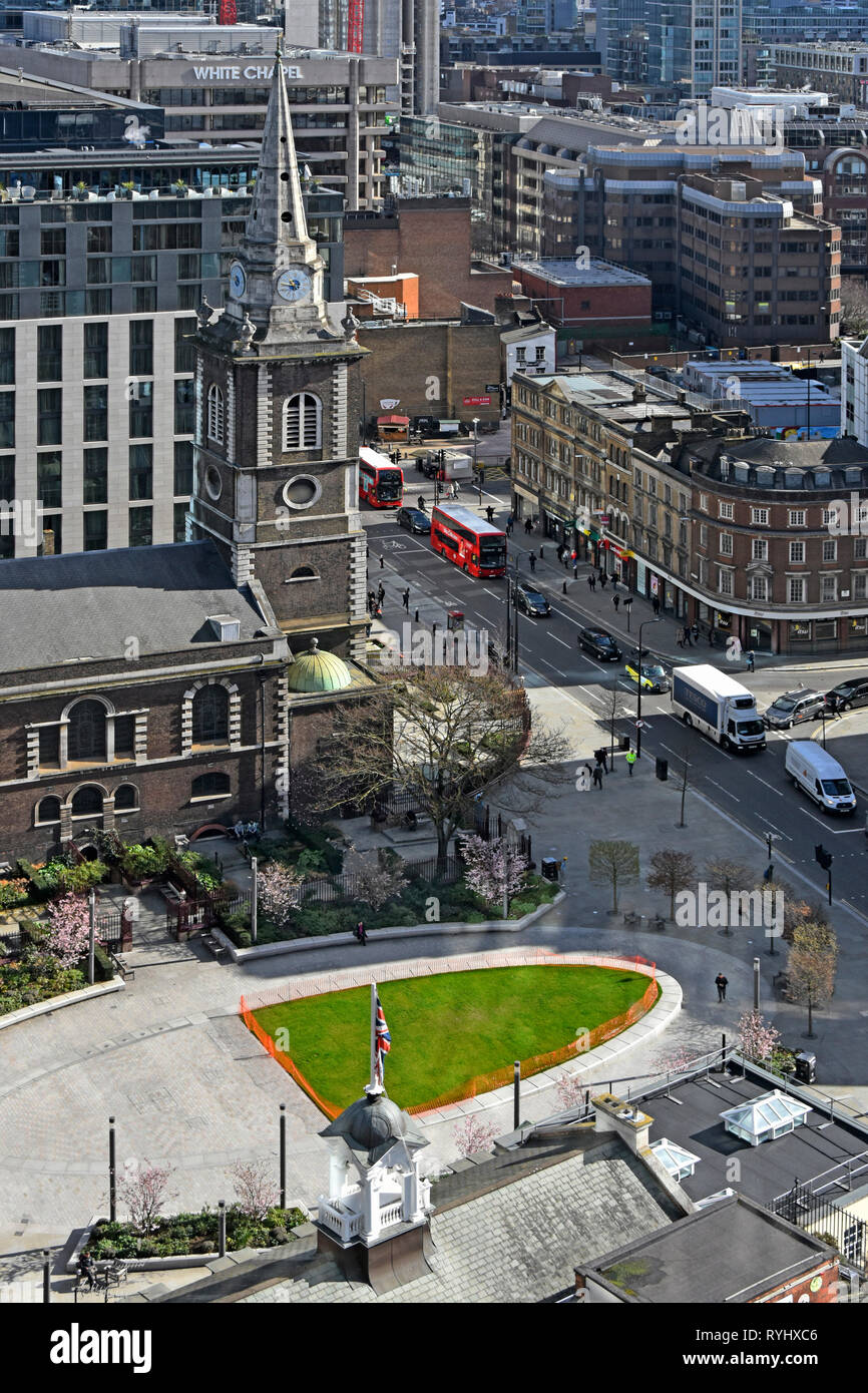 Aerial birds eye view from high above St Botolph church & street scene traffic in Aldgate High Street with Aldgate Square Green open space London UK Stock Photo