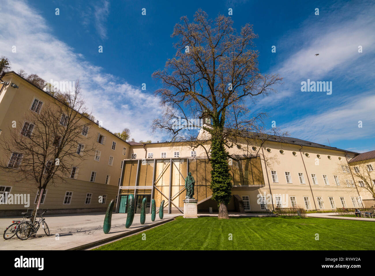 Salzburg, Austria - April 6, 2018: Modern artwork "Gurken" (Cucumbers) by austrian artist Erwin Wurm and Friedrich Schiller monument (1867) Stock Photo