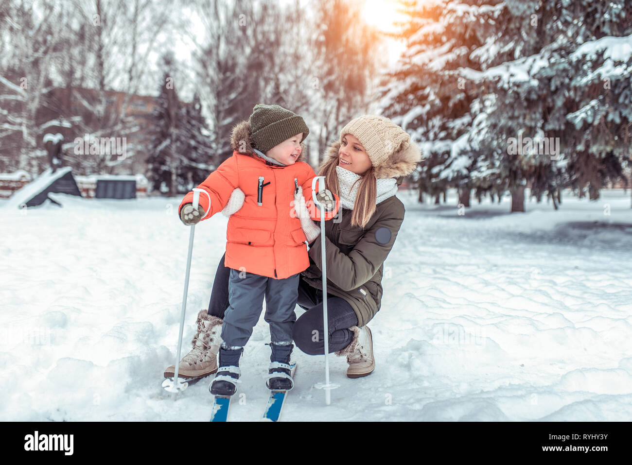 A young woman, mother supports with care, little boy son 36 years old