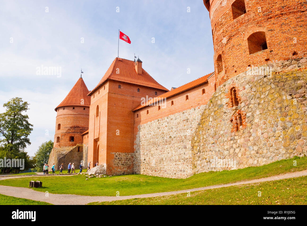 Trakai, Lithuania - September 16, 2015: People entering Trakai Island Castle through the main gate. Entrance and corner towers of Trakai Island Castle Stock Photo