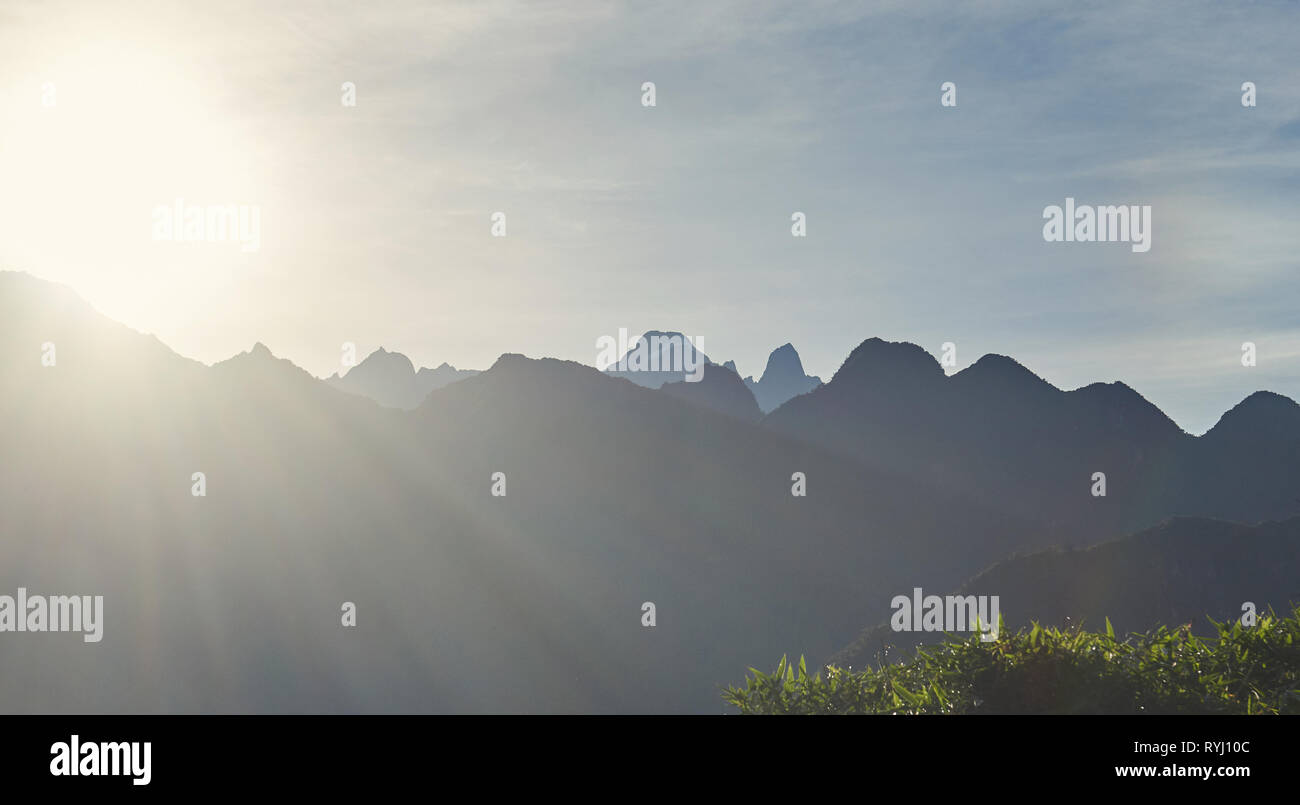 Sunrise in mountain landscape background. Mountain peak on sky background Stock Photo