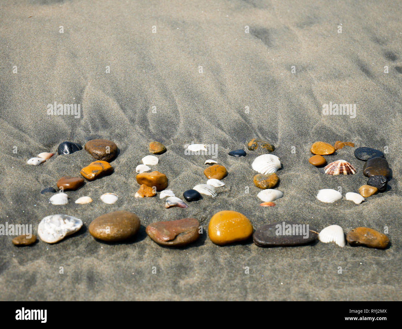 2019 sign made up with pebbles and sea shells on the sea shore of a beach near Cartagena Colombia Stock Photo