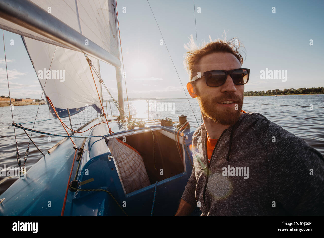 Old man driving boat hi-res stock photography and images - Alamy