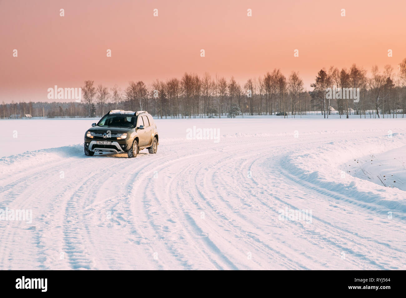Gomel, Belarus - January 10, 2019: Car Renault Duster Or Dacia Duster Suv Parked On Winter Snowy Field Countryside Landscape Under Scenic Sky At Sunse Stock Photo