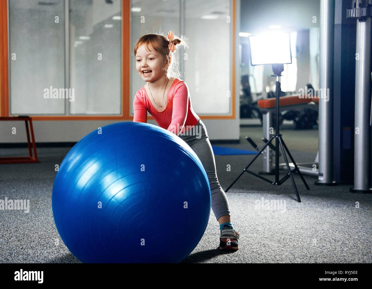 happy girls training in the gym with a big gym ball Stock Photo - Alamy