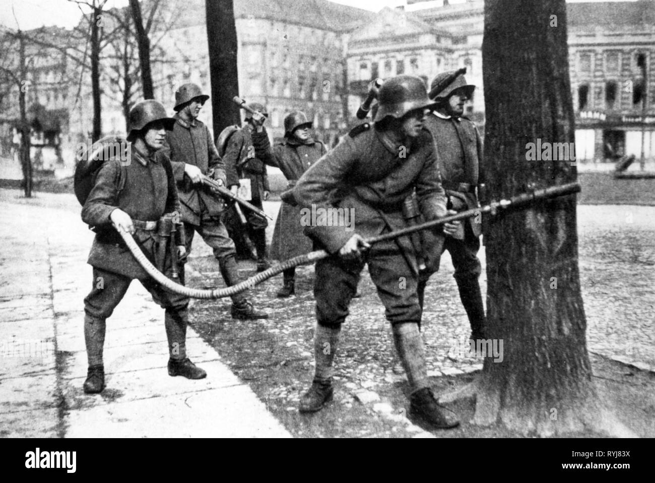 Revolution 1918 - 1919, Germany, Berlin, government forces with flame-thrower at Alexanderplatz, military, army, armies, armed forces, Garde-Kavallerie-Schützen-Division, Guards Cavalry Rifle Division, flame-thrower, flame-throwers, weapons, arms, weapon, arm, hand grenade, grenade, hand grenades, street fighting, street fightings, soldiers, soldier, Free State of Prussia, German Reich, republic, republics, civil war, German Revolution of 1918-1919, 1910s, 10s, 20th century, people, men, man, male, group, groups, revolution, revolutions, governme, Additional-Rights-Clearance-Info-Not-Available Stock Photo