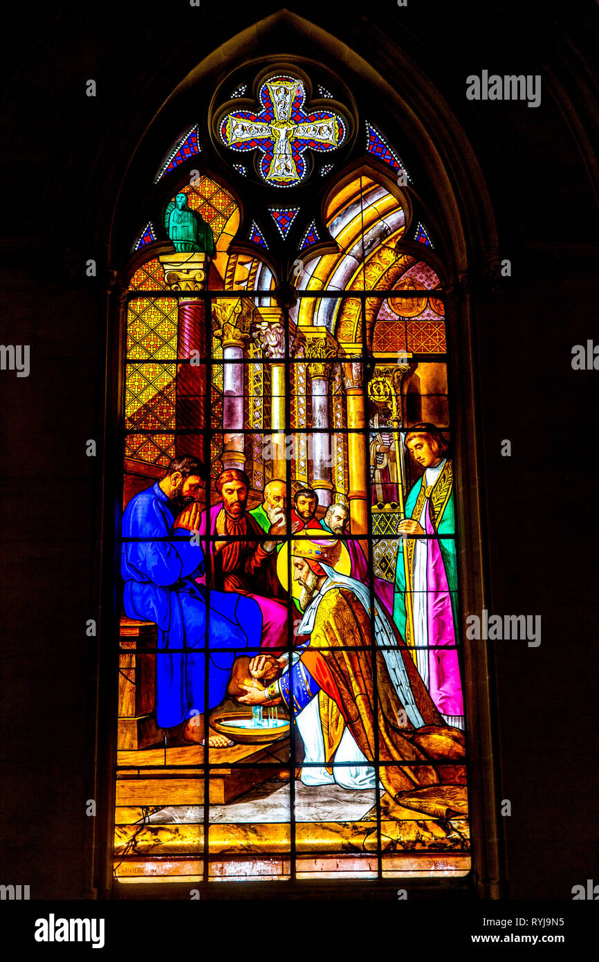 The Royal Chapel in Dreux, France. Stained glass. King Saint Louis washing feet. Stock Photo