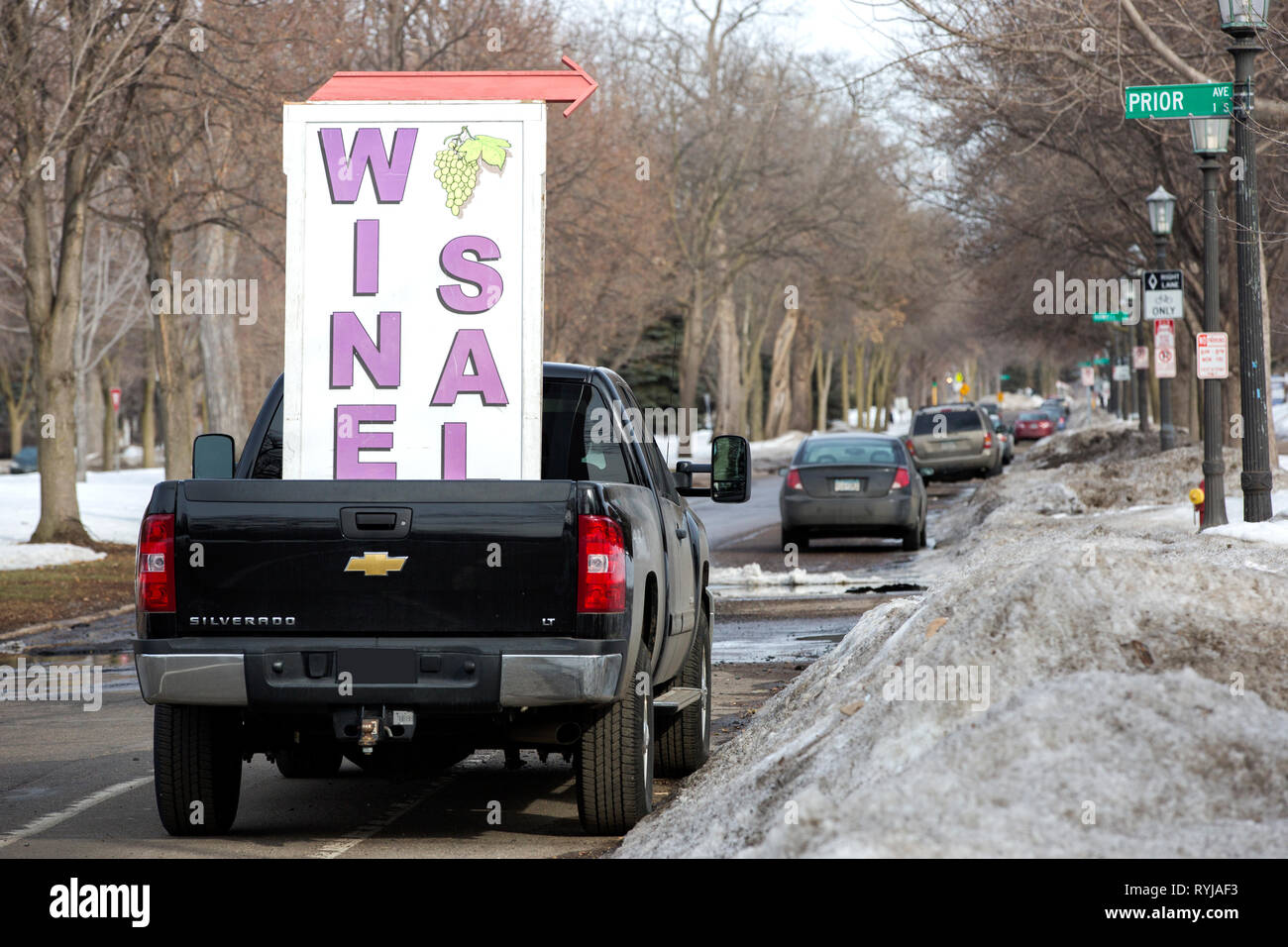 Mobile wine sale sign on a pickup truck on Summit Avenue in St. Paul, Minnesota. Stock Photo