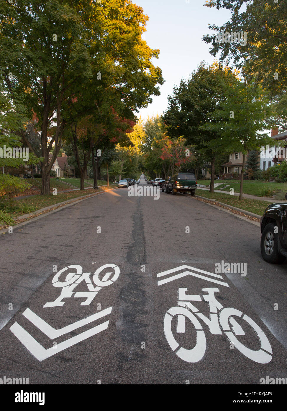 A shared-lane marking or sharrow marking for a bicycle route on Jefferson Avenue in St. Paul, Minnesota.  In the US, the wide shape of the arrow combi Stock Photo