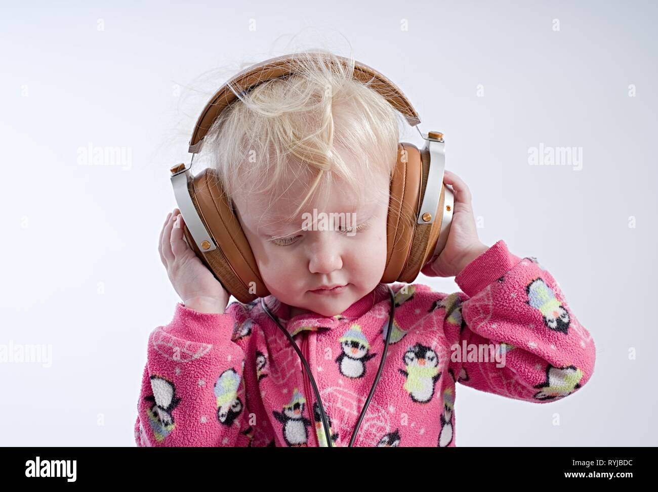 Baby listening music in headphones Stock Photo Alamy