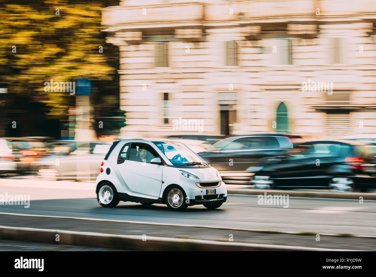 Rome, Italy - October 21, 2018: White Color Smart Fortwo Car Of Second Generation W451 Moving At Street. Stock Photo