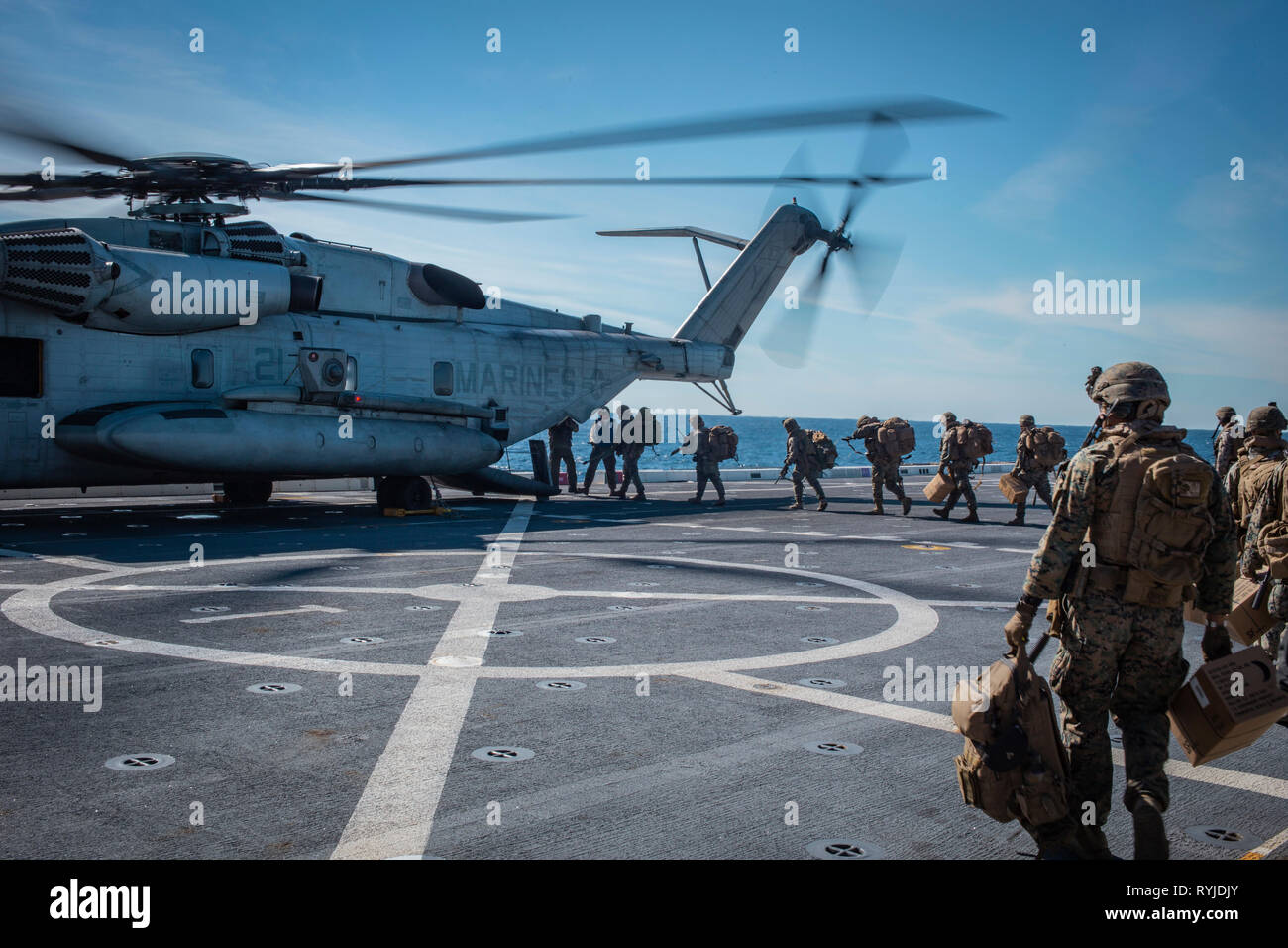190222-M-ET529-1143 PACIFIC OCEAN (Feb. 22, 2019) U.S. Marines with Kilo Company, Battalion Landing Team 3rd Battalion, 5th Marine Regiment, 11th Marine Expeditionary Unit (MEU), board a CH-53E Super Stallion to depart the San Antonio-class amphibious transport dock ship USS John P. Murtha (LPD 26). The Marines and Sailors of the 11th MEU are conducting routine operations as part of the Boxer Amphibious Ready Group in the eastern Pacific Ocean. (U.S. Marine Corps photo by Lance Cpl. Israel Chincio) Stock Photo