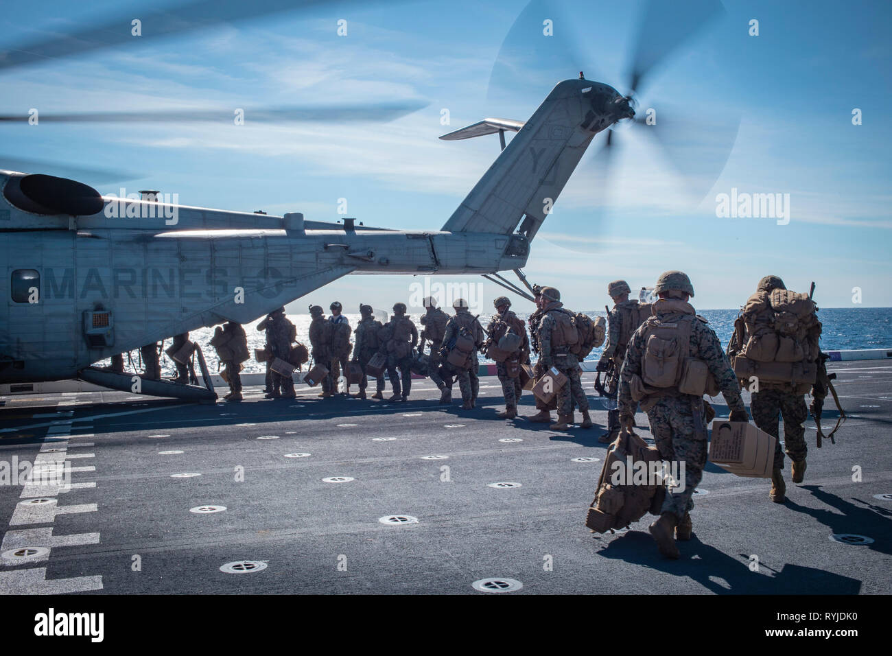 190222-M-ET529-1150 PACIFIC OCEAN (Feb. 22, 2019) U.S. Marines with Kilo Company, Battalion Landing Team 3rd Battalion, 5th Marine Regiment, 11th Marine Expeditionary Unit (MEU), board a CH-53E Super Stallion to depart the San Antonio-class amphibious transport dock ship USS John P. Murtha (LPD 26). The Marines and Sailors of the 11th MEU are conducting routine operations as part of the Boxer Amphibious Ready Group in the eastern Pacific Ocean. (U.S. Marine Corps photo by Lance Cpl. Israel Chincio) Stock Photo