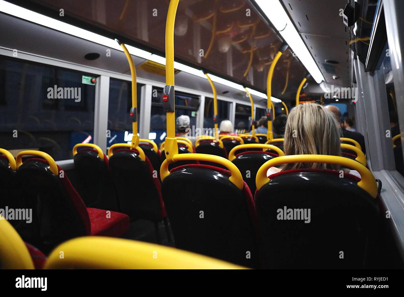 Bus passengers on the top deck of a night bus, London, England, UK Stock Photo