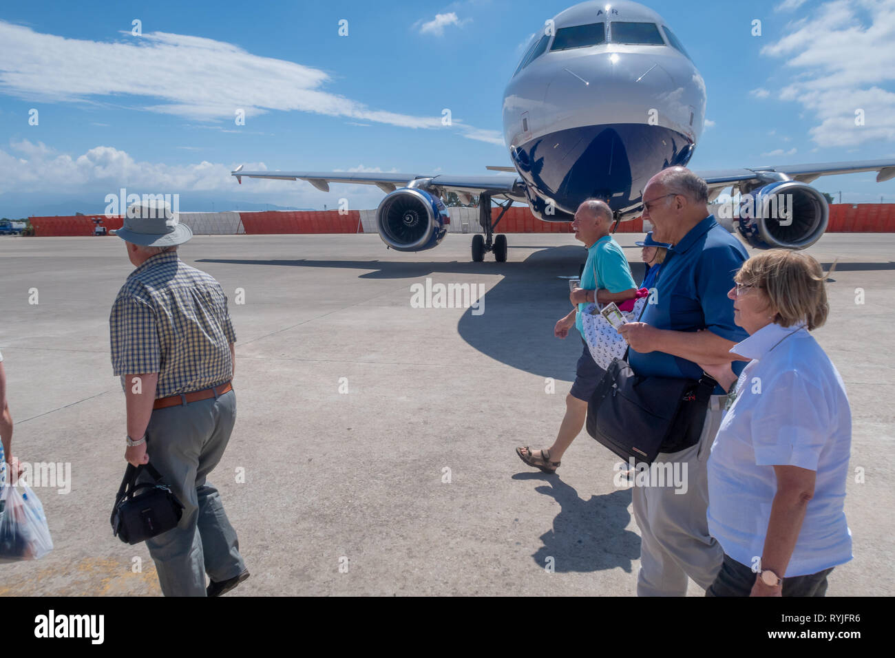 PREVEZA, GREECE - JUNE 10 2018: Passengers walking past a British Airways airplane on Preveza airport tarmac in Greece Stock Photo