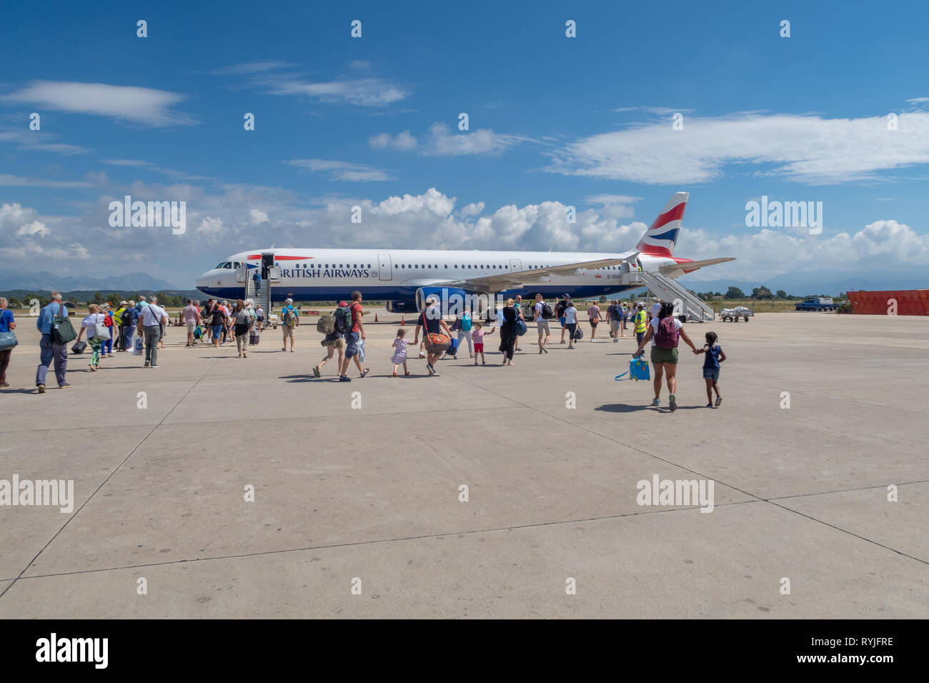 PREVEZA, GREECE - JUNE 10 2018: Passengers walking towards a British Airways airplane on Preveza airport tarmac in Greece Stock Photo