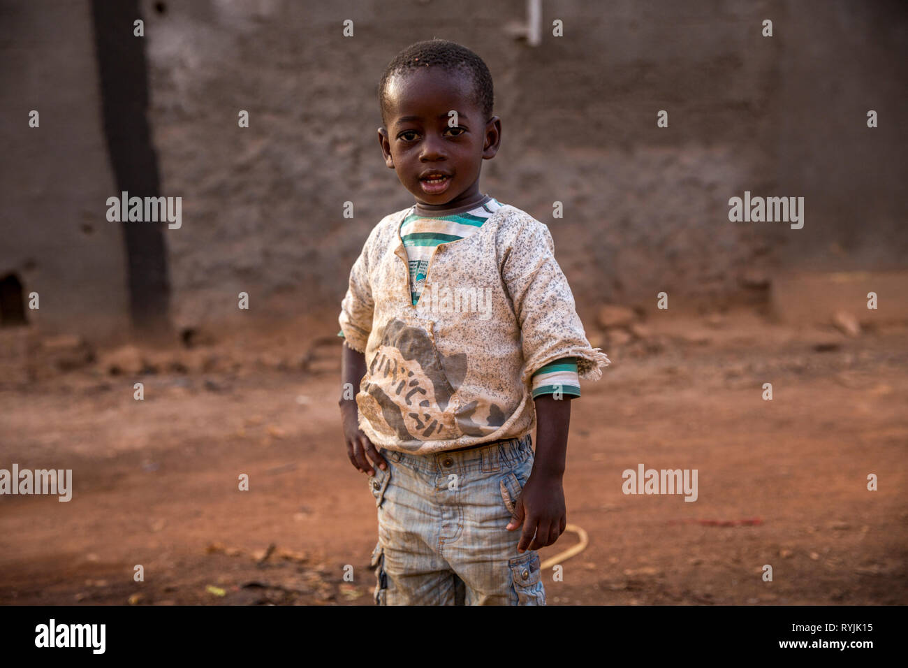 Boy standing in a Ougadougou street, Burkina Faso. Stock Photo