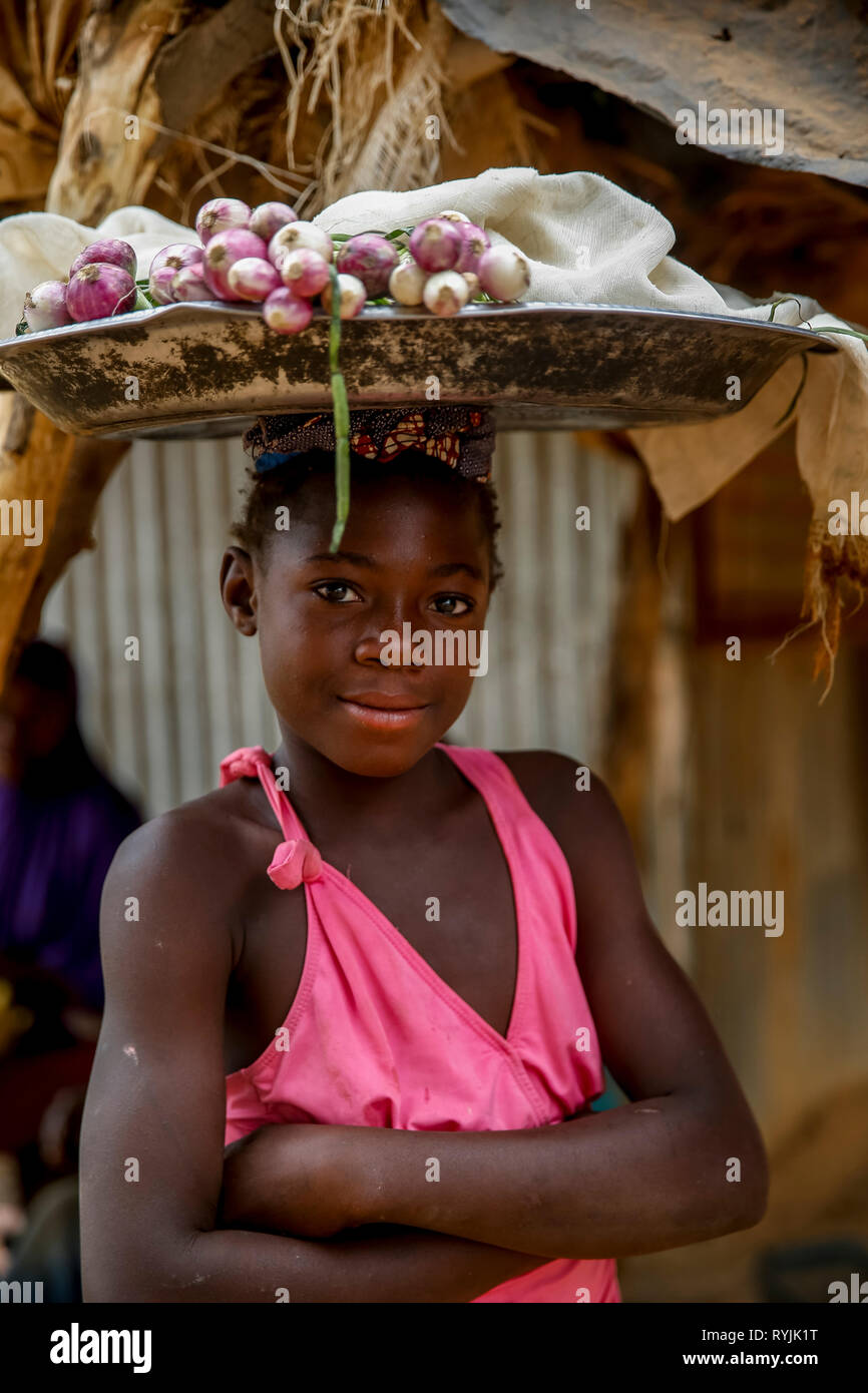 Girl selling onions in Tenkodogo, Burkina Faso. Stock Photo