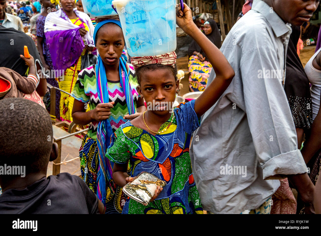 Girls selling water at Tenkodogo market, Burkina Faso. Stock Photo