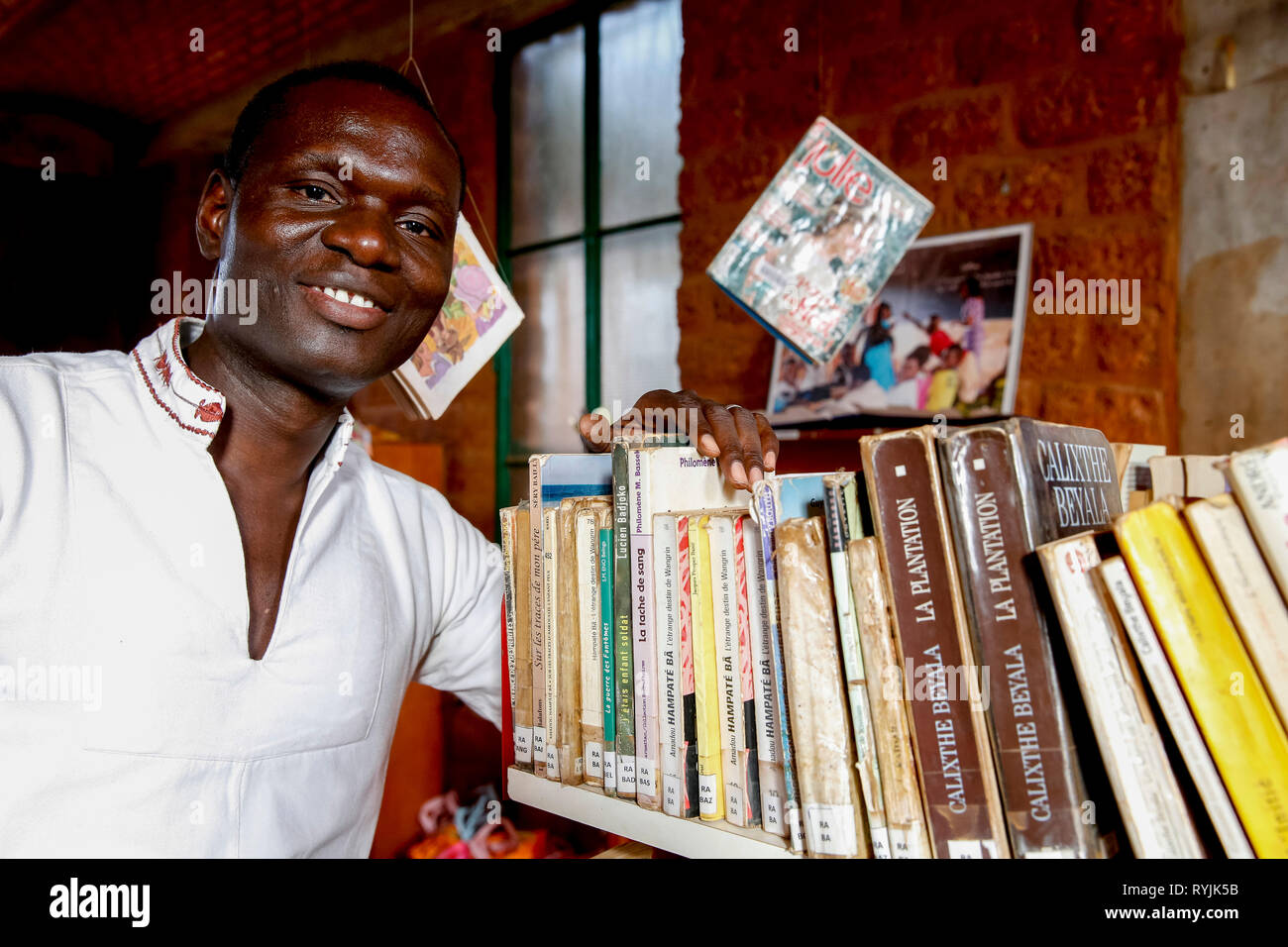 ICCV Nazemse NGO director Simon Nacoulma in the library, Ouagadougou, Burkina Faso. Stock Photo