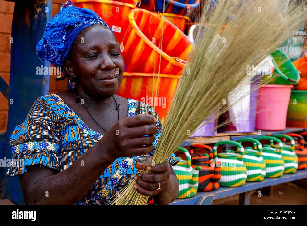 Shopkeeper making craft in Koudougou, Burkina Faso. Stock Photo