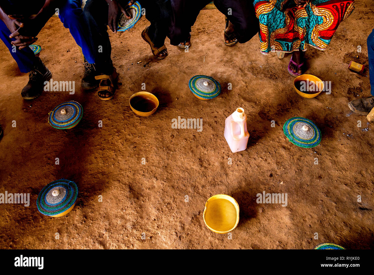 Clients of a bar drinking locally brewed dollo in Koudougou, Burkina Faso. Stock Photo