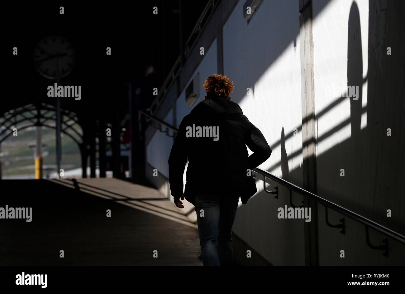 Railway Station.  Young man walking to catch his train.  Vevey. Switzerland. Stock Photo