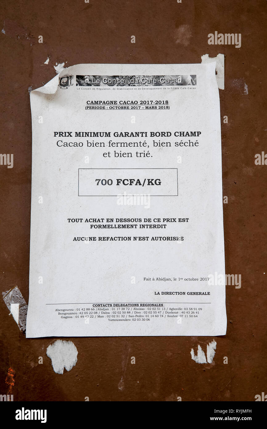 Poster advertising a guaranteed price for cocoa (in French) in Agboville, Ivory Coast. Stock Photo
