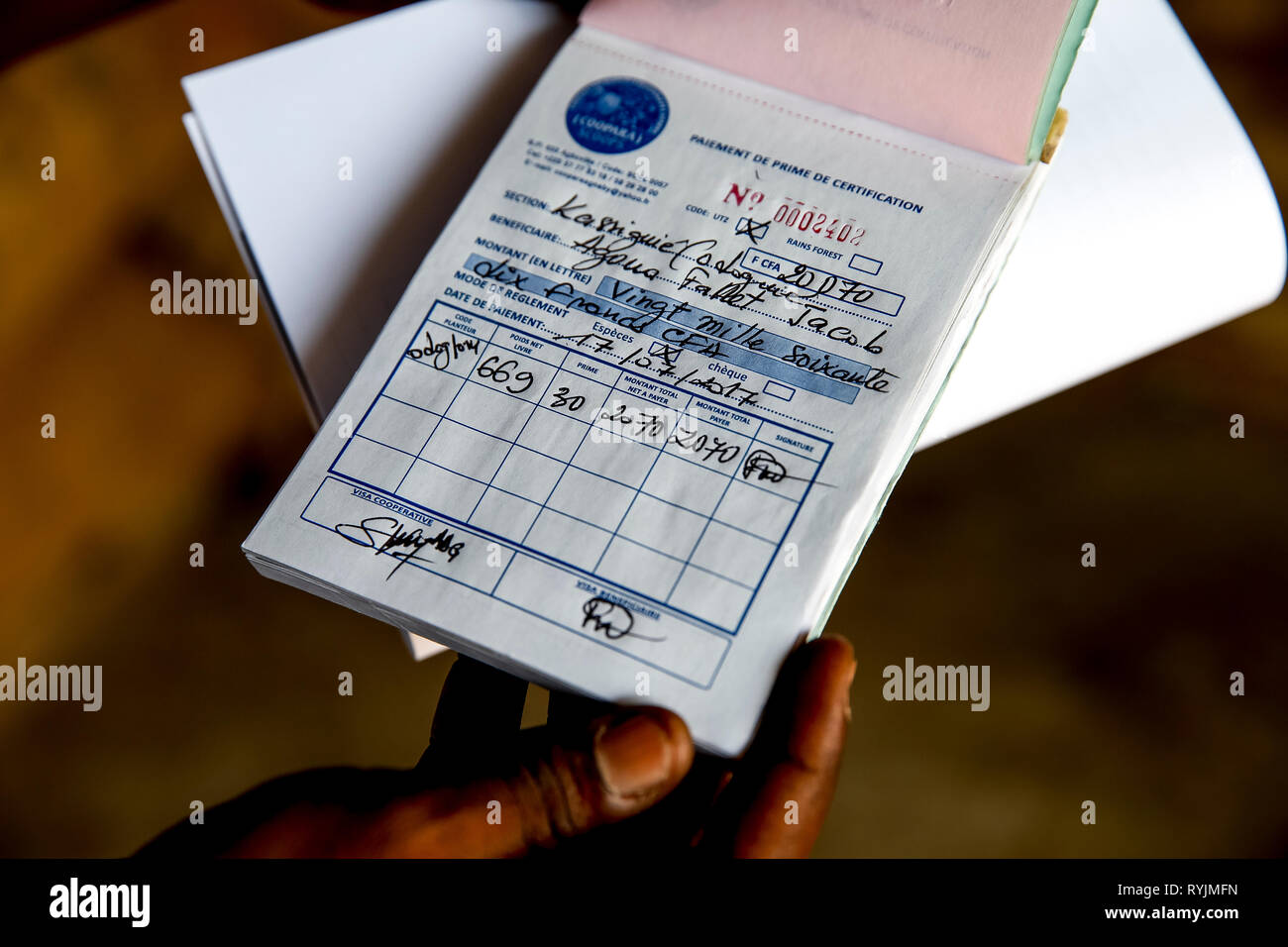 Premium receipt given to a cocoa planter in Agboville, Ivory Coast. Stock Photo