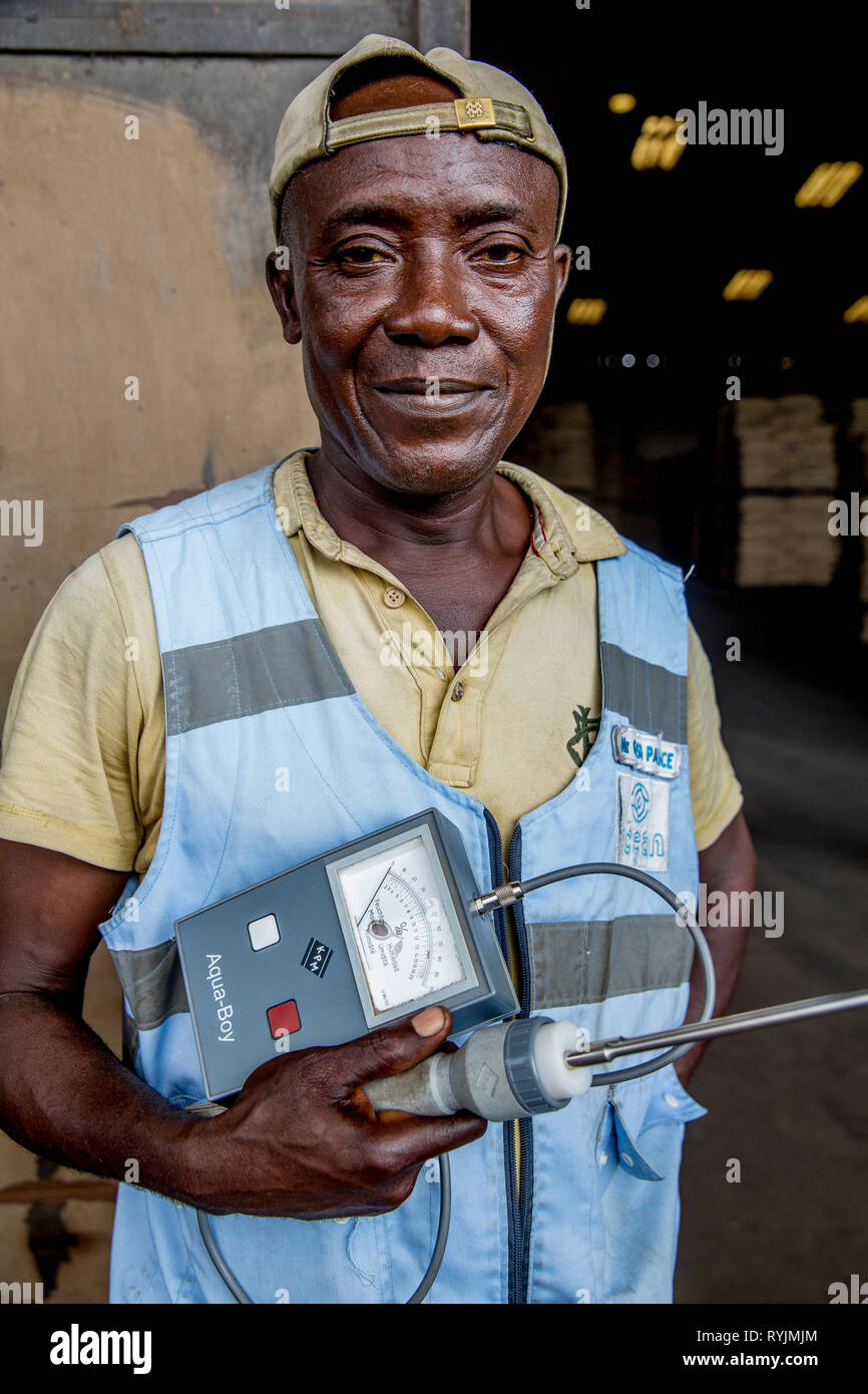Cocoa humidity checker at Abidjan port. Stock Photo