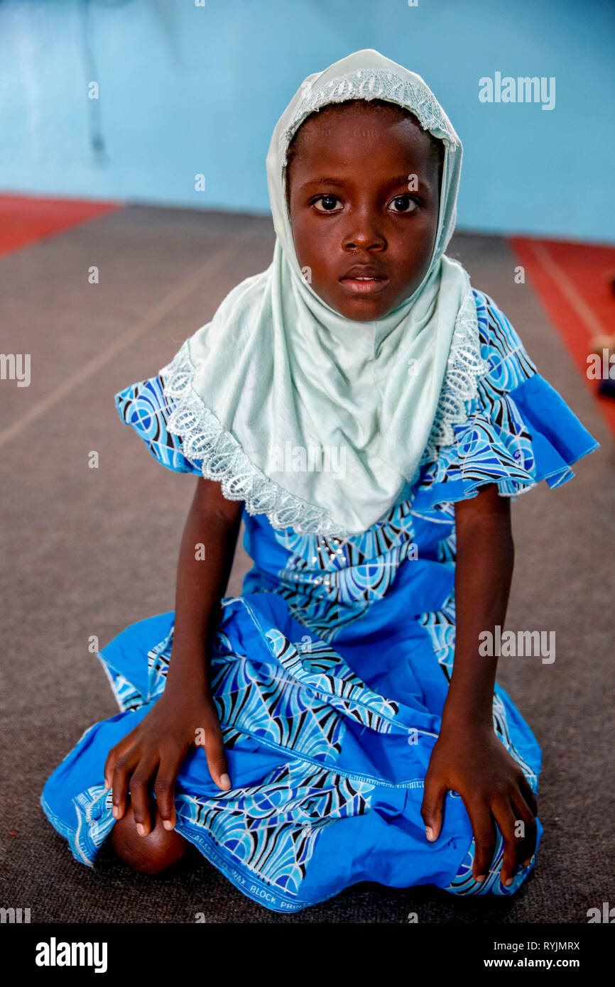 Muslim girl in an Abidjan mosque, Ivory Coast. Stock Photo