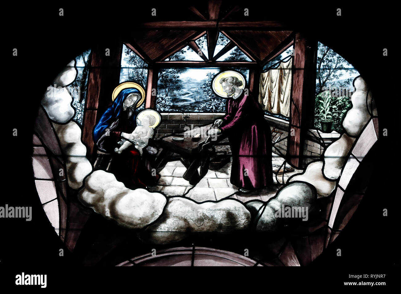Saint Etienne du Mont church.  Stained glass window. Holy family, Joseph carpenter.  Paris. France. Stock Photo