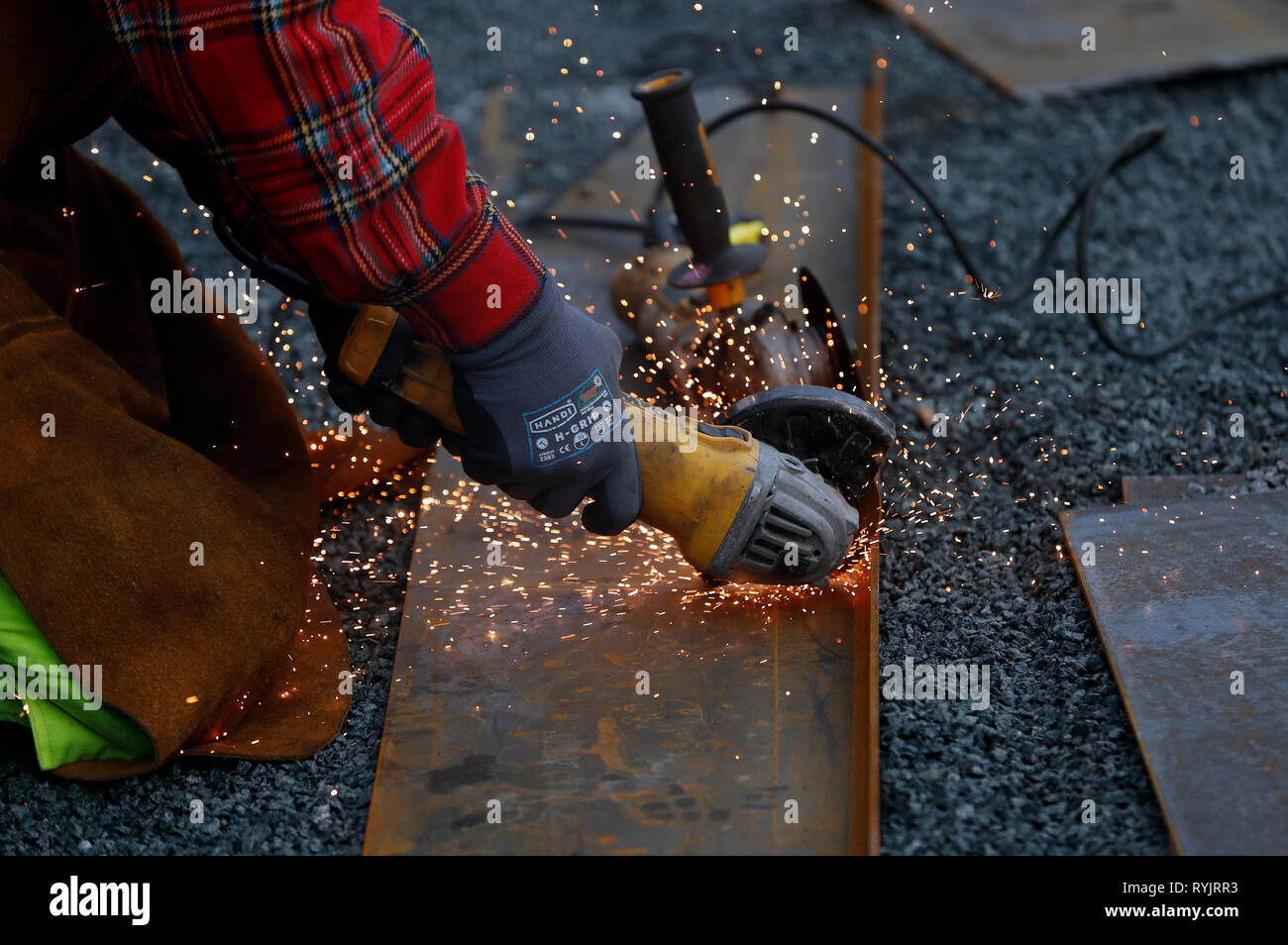 Construction worker working on construction site. Circular saw.  Trondheim. Norway. Stock Photo