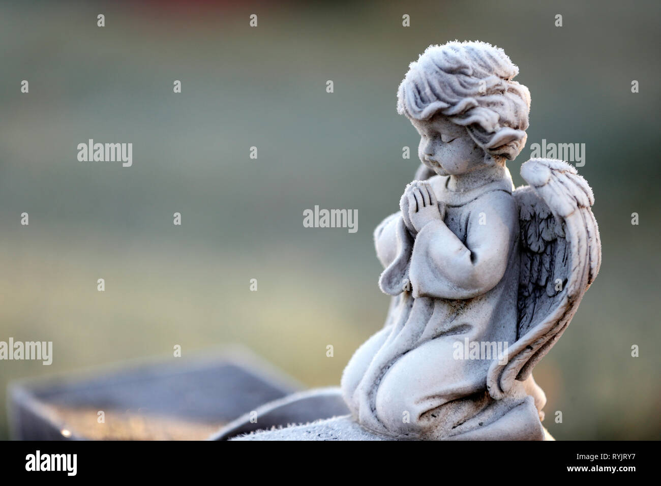 Angel statue in winter.  Cemetery.  Lundamo. Norway. Stock Photo