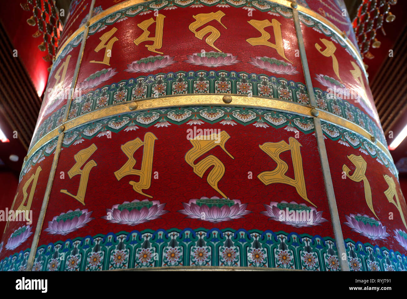 Buddha Tooth Relic Temple in Chinatown. Viarocana Buddha prayer wheel